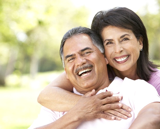 smiling couple after getting All-On-4 in West Seneca