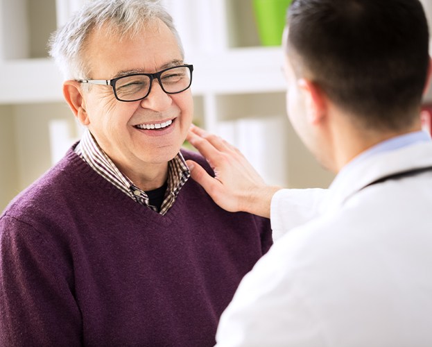 Dentist and patient discuss oral cancer