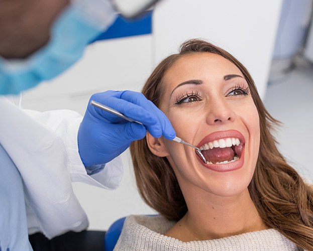 Woman receiving professional dental cleaning in West Seneca