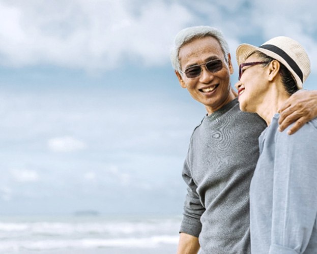 happy couple showing the benefits of dentures in West Seneca