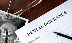 dental insurance paperwork for the cost of dental implants in West Seneca