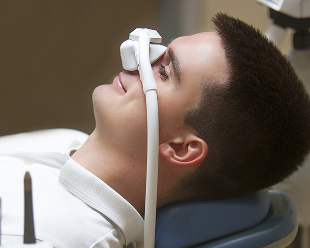 Man with nitrous oxide dental sedaiton mask in place