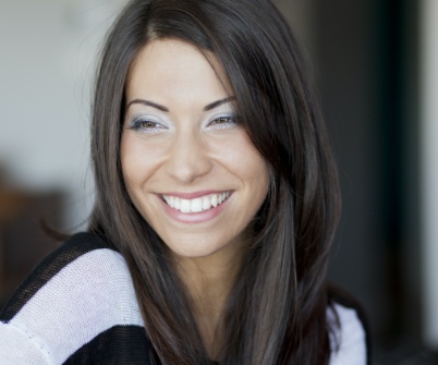Woman with gorgeous smile after cosmetic dentistry