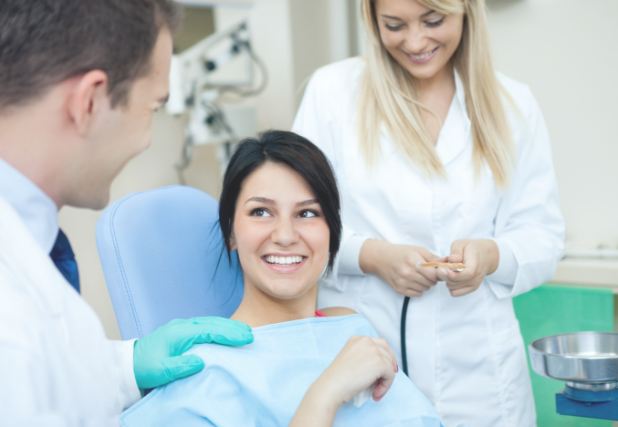 Dental patient smiling at dentist