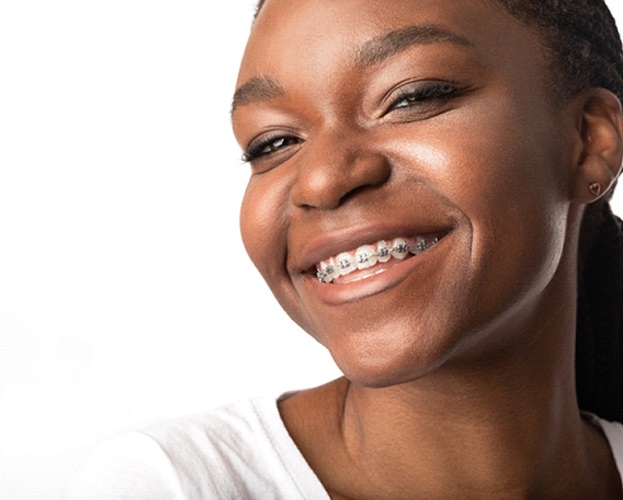 woman smiling with traditional braces in West Seneca