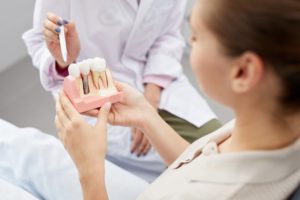 patient talking with a dentist about dental implants